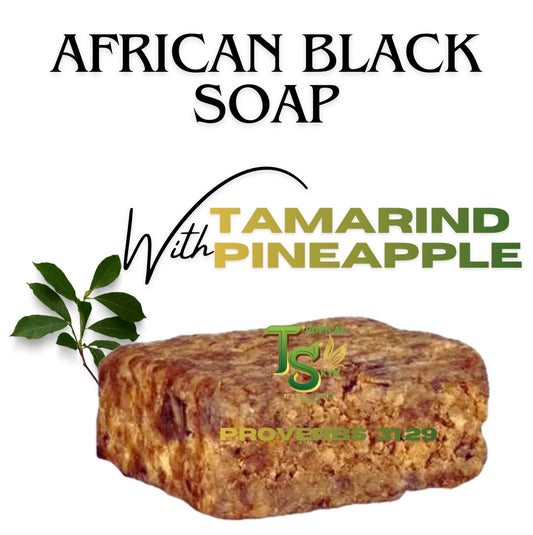 African Black Soap bar with tamarind and pineapple on a white background